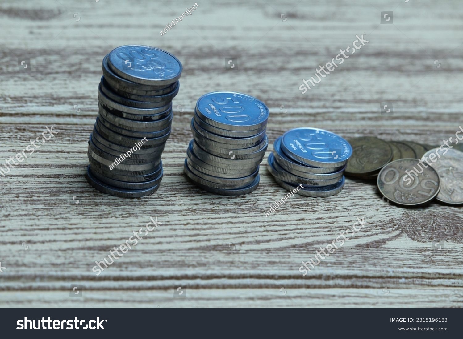 Pile of coins on the table. Financial and business concept. #2315196183