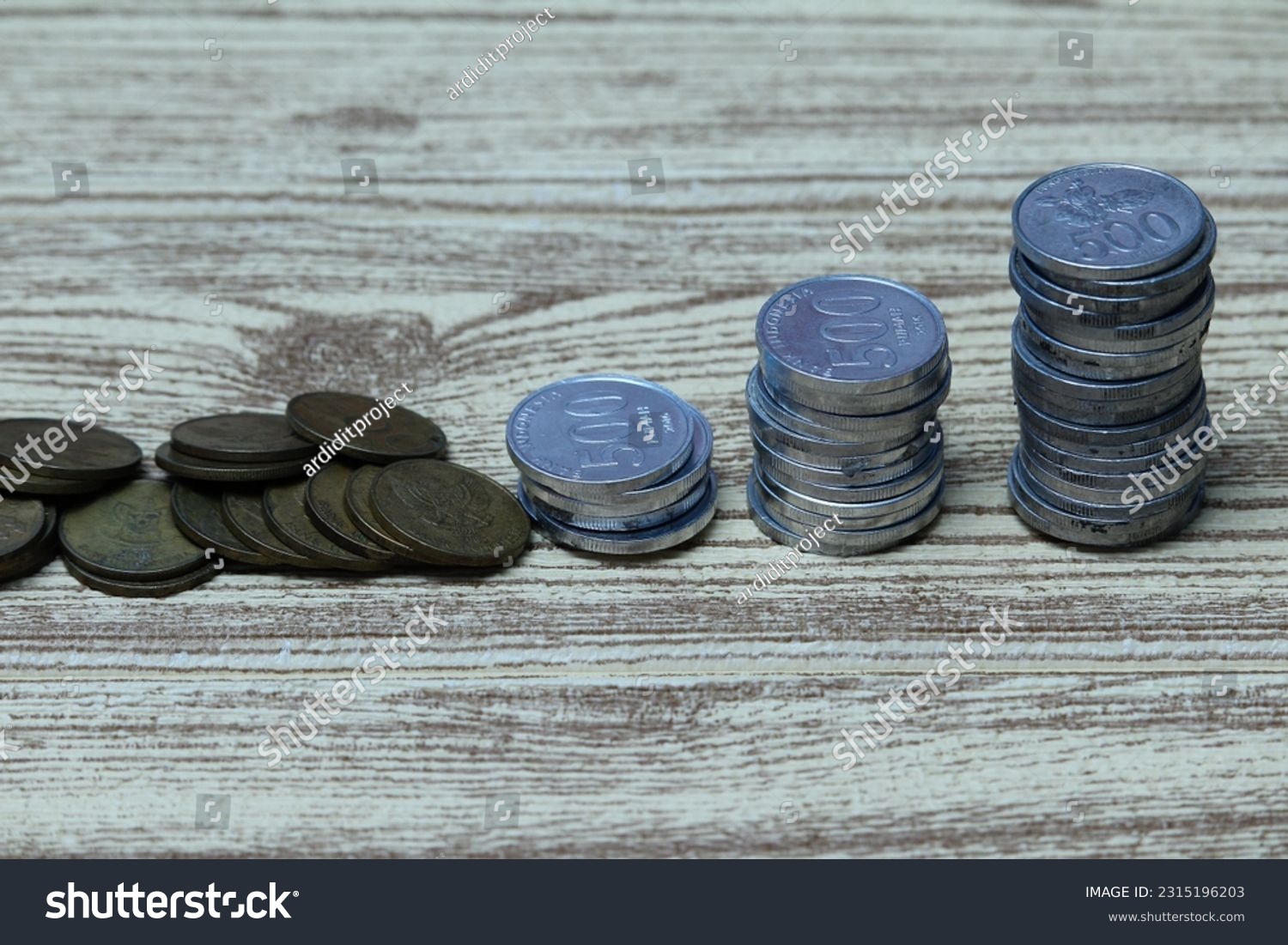 Pile of coins on the table. Financial and business concept. #2315196203