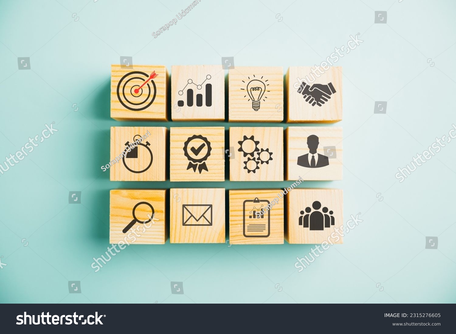Wooden cube block step on a table with Action Plan, Goal, and Target icons. Success and business target concept. Project management and company strategy on a blue background. #2315276605
