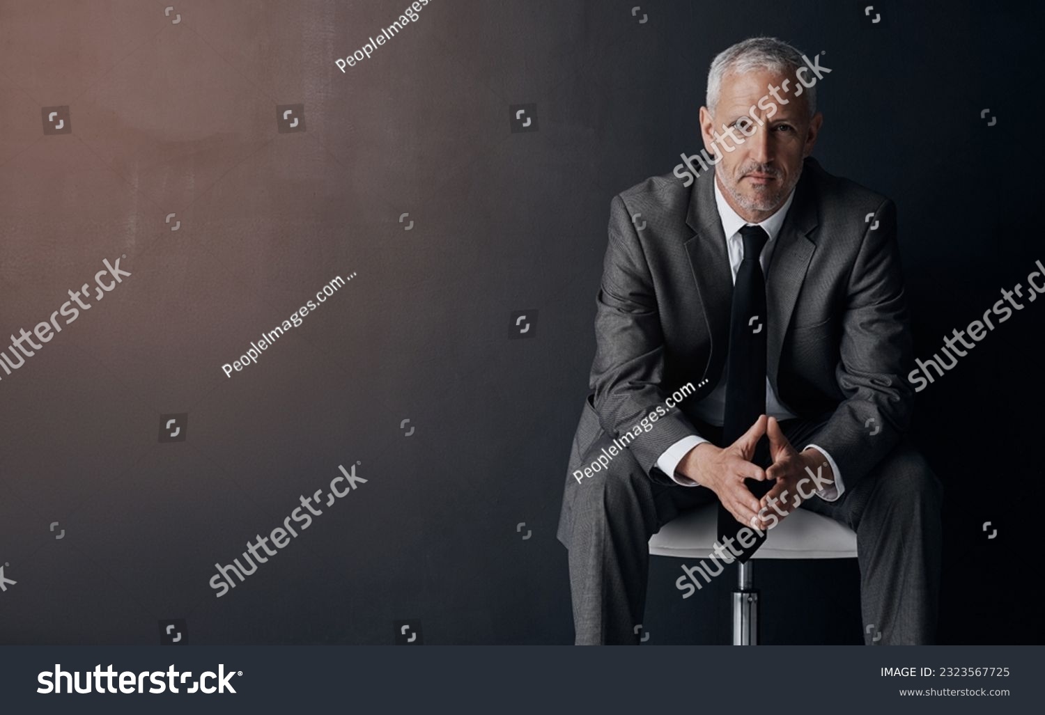 Mock up, chair and serious portrait of lawyer, attorney or businessman with confidence on dark background in studio space. Boss, ceo or business owner, proud senior executive director at law firm. #2323567725