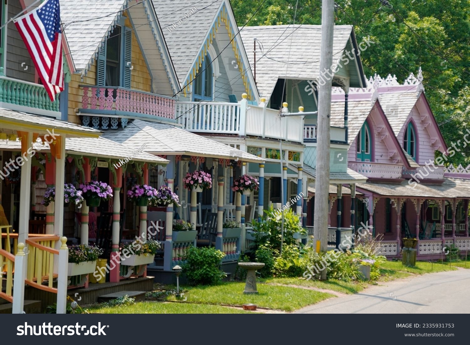 Beautiful colorful gingerbread houses, cottages in Oak Bluffs center, Martha's Vineyard island in Massachusetts USA on a sunny summer day #2335931753