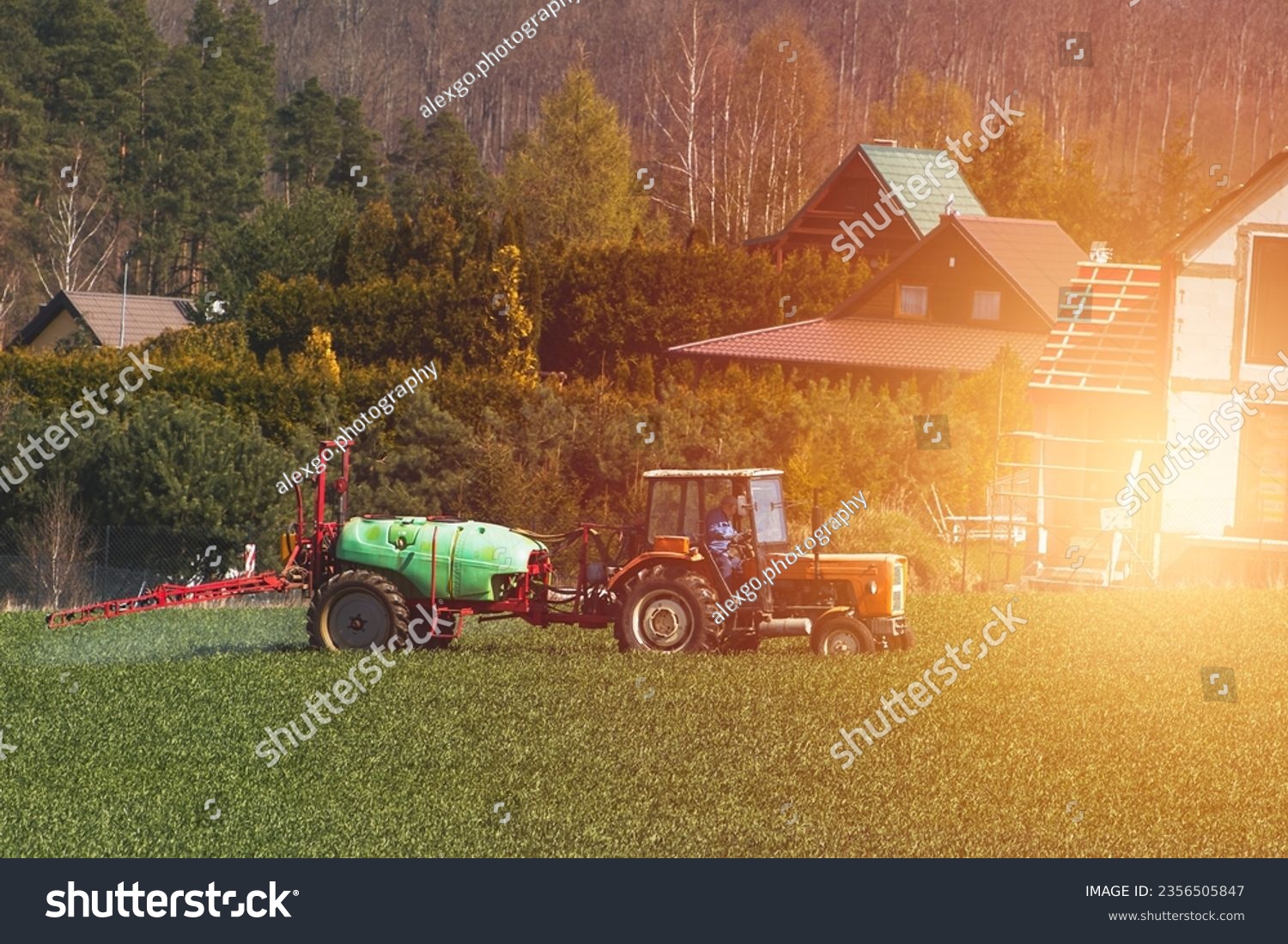 Efficient Agricultural Operations. Machinery Cultivating Fields and Harvesting at Sunset. Rural landscape. #2356505847