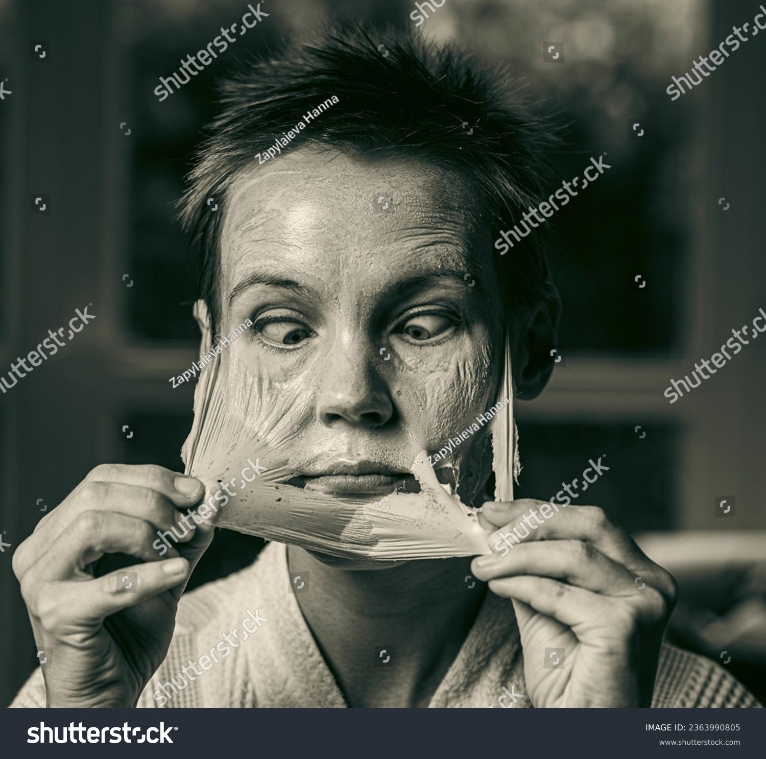 woman 43 years old with a cosmetic mask on her face #2363990805