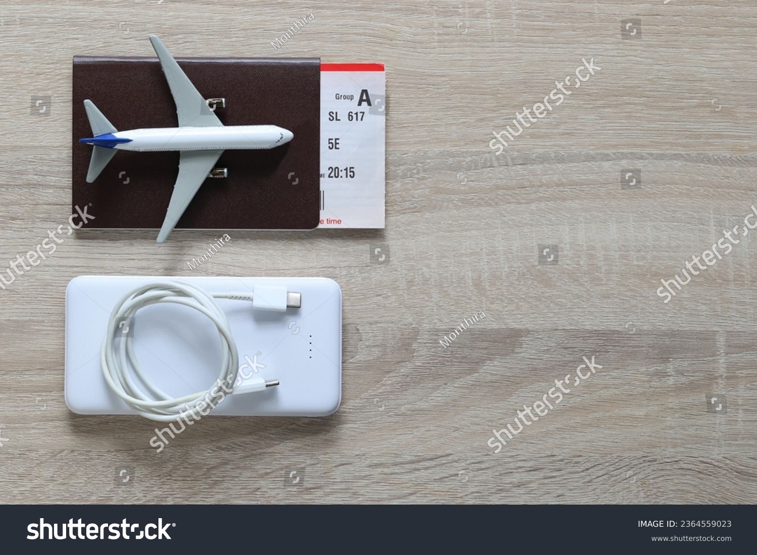 Airplane on passport and power bank for travel of holiday #2364559023