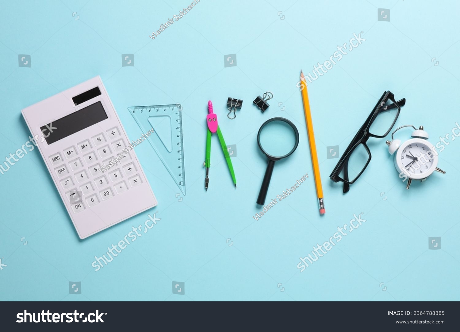 Set of school supplies on a blue background. Top idl #2364788885