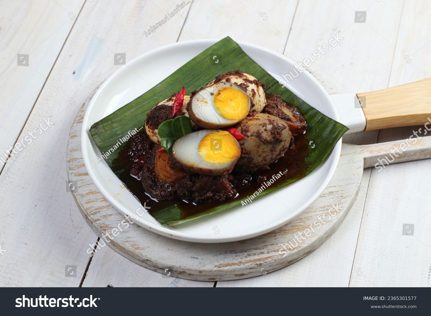 Balado Telor is a traditional Indonesian dish, eggs are boiled and then cooked with chili sauce #2365301577
