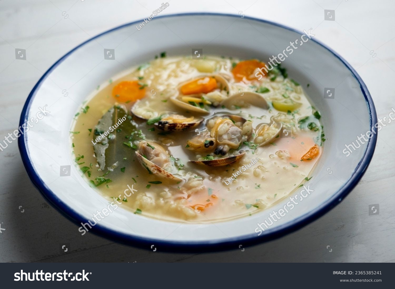 Noodle soup with clams and carrots and other seasonal vegetables. #2365385241