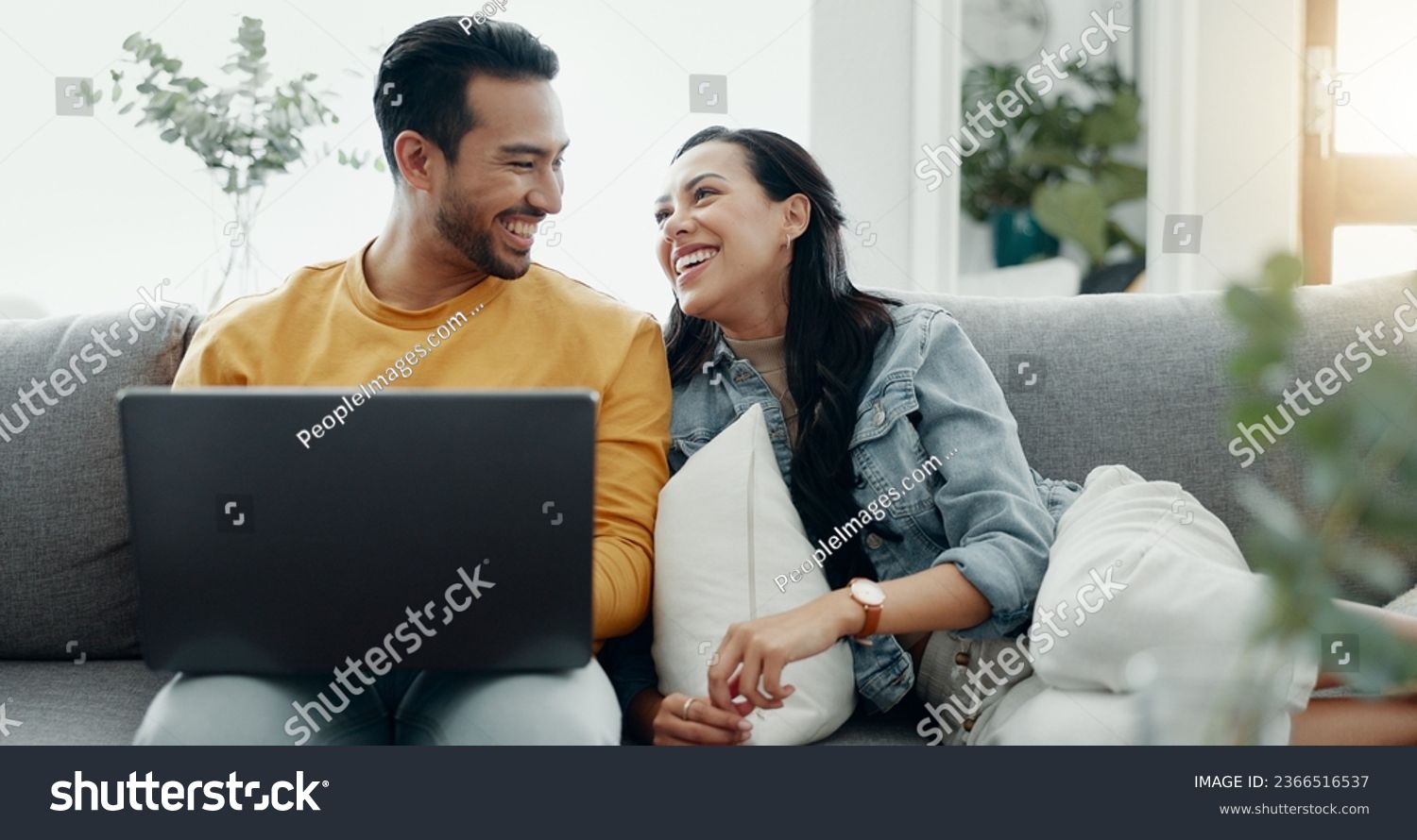 Couple, laptop and laugh on sofa in home for meme, watch movies and streaming funny multimedia. Happy man, woman and relax at computer in living room on social media, web subscription or comedy show #2366516537