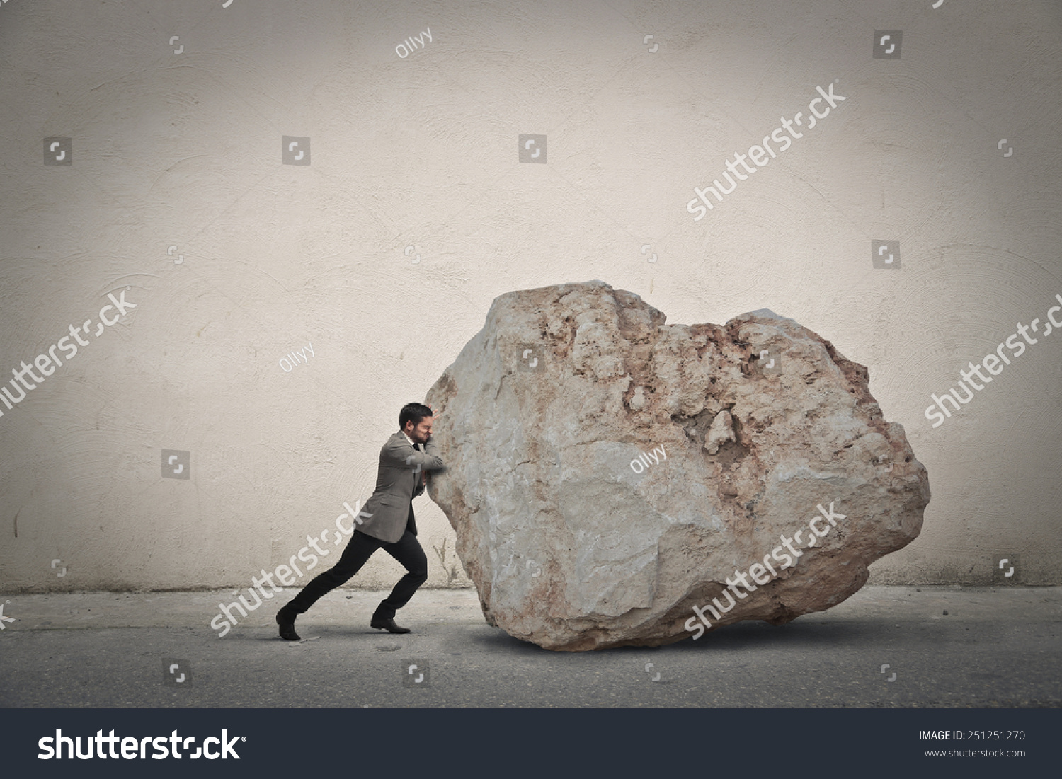 Businessman pushing a boulder  #251251270