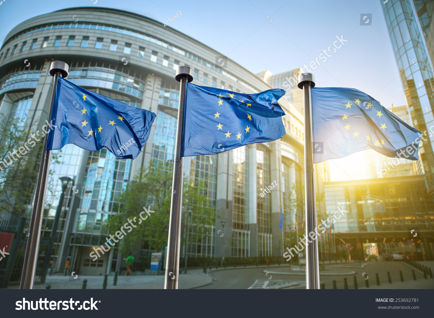 European union flag against parliament in Brussels, Belgium #253692781