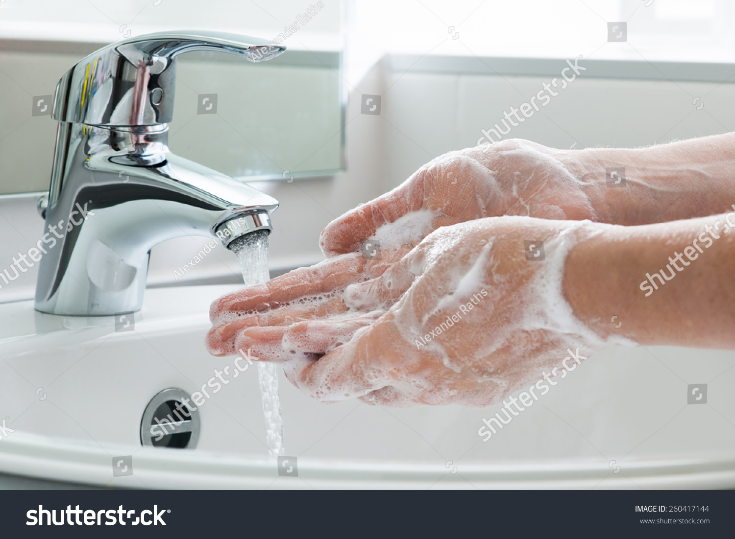 Hygiene concept. Washing hands with soap under the faucet with water #260417144
