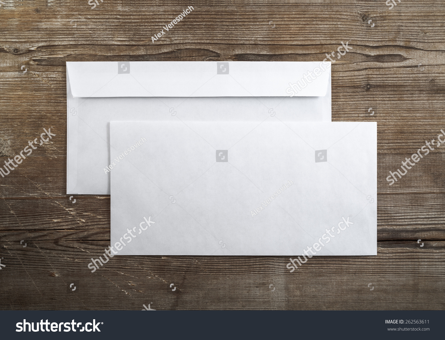 Photo of blank envelopes on a dark wooden background. Back and front. Template for branding identity. Top view. #262563611