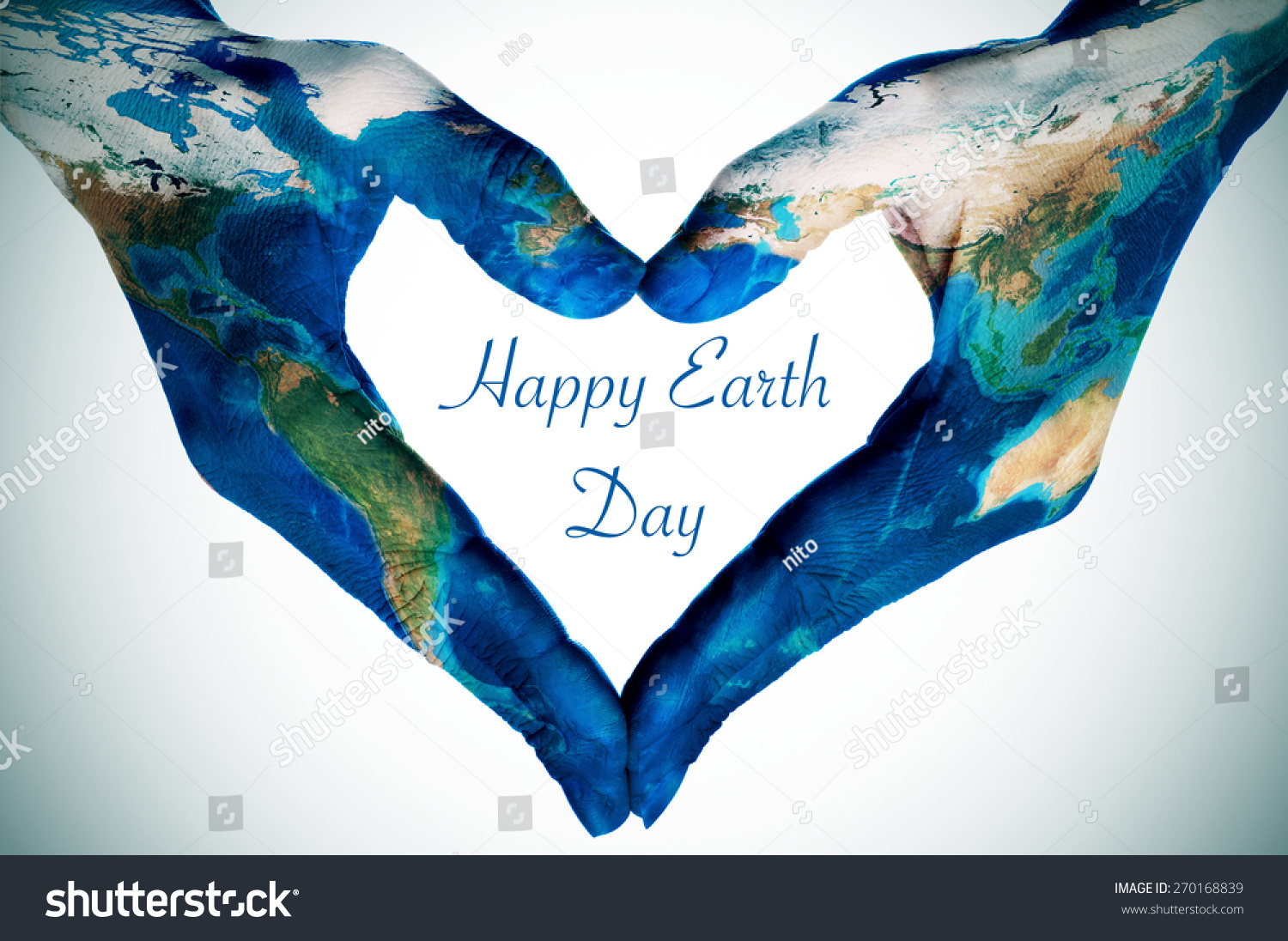 the hands of a young woman forming a heart patterned with a world map (furnished by NASA) and the text happy earth day #270168839