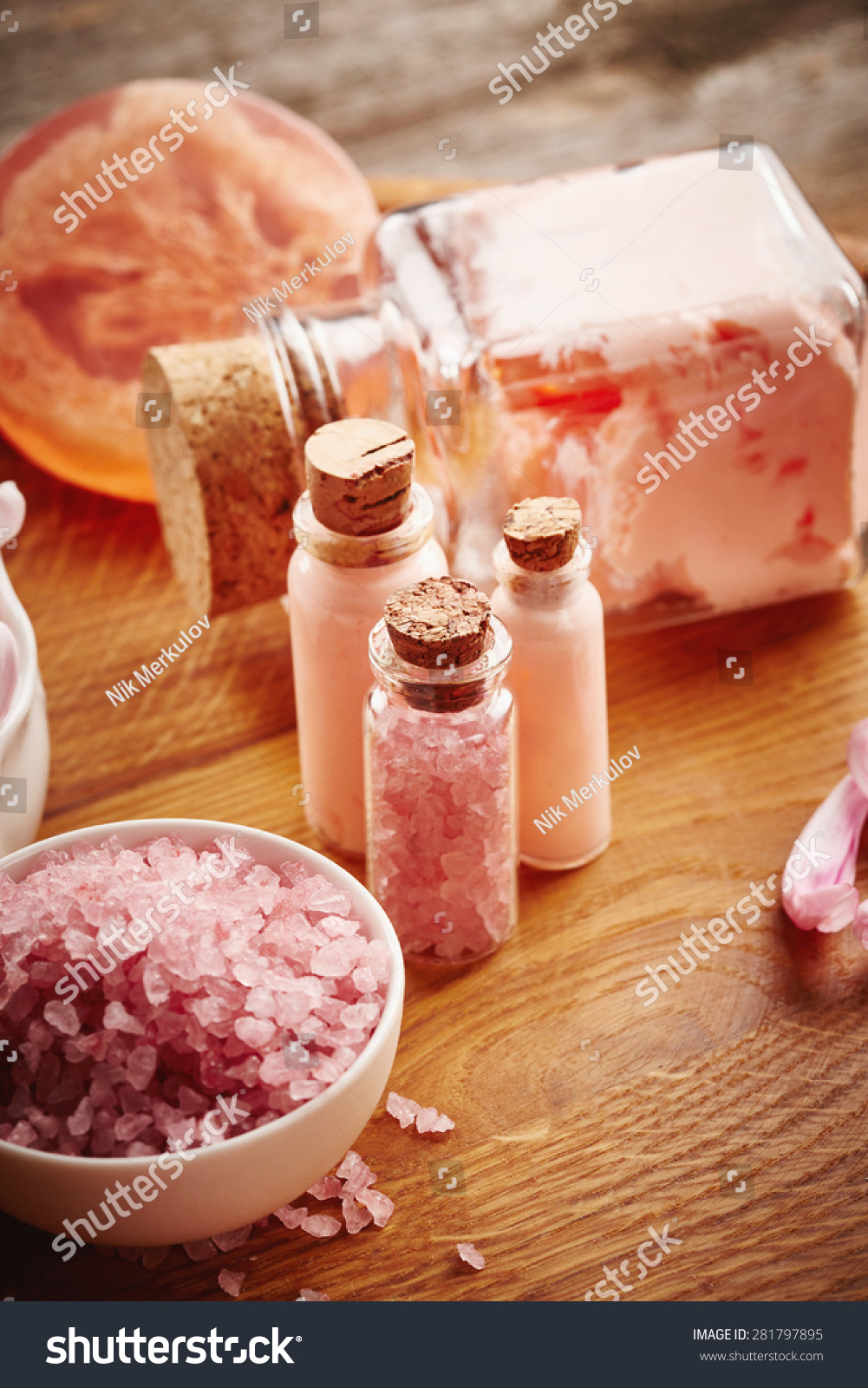 Pink spa still life with flower petals on wooden background #281797895
