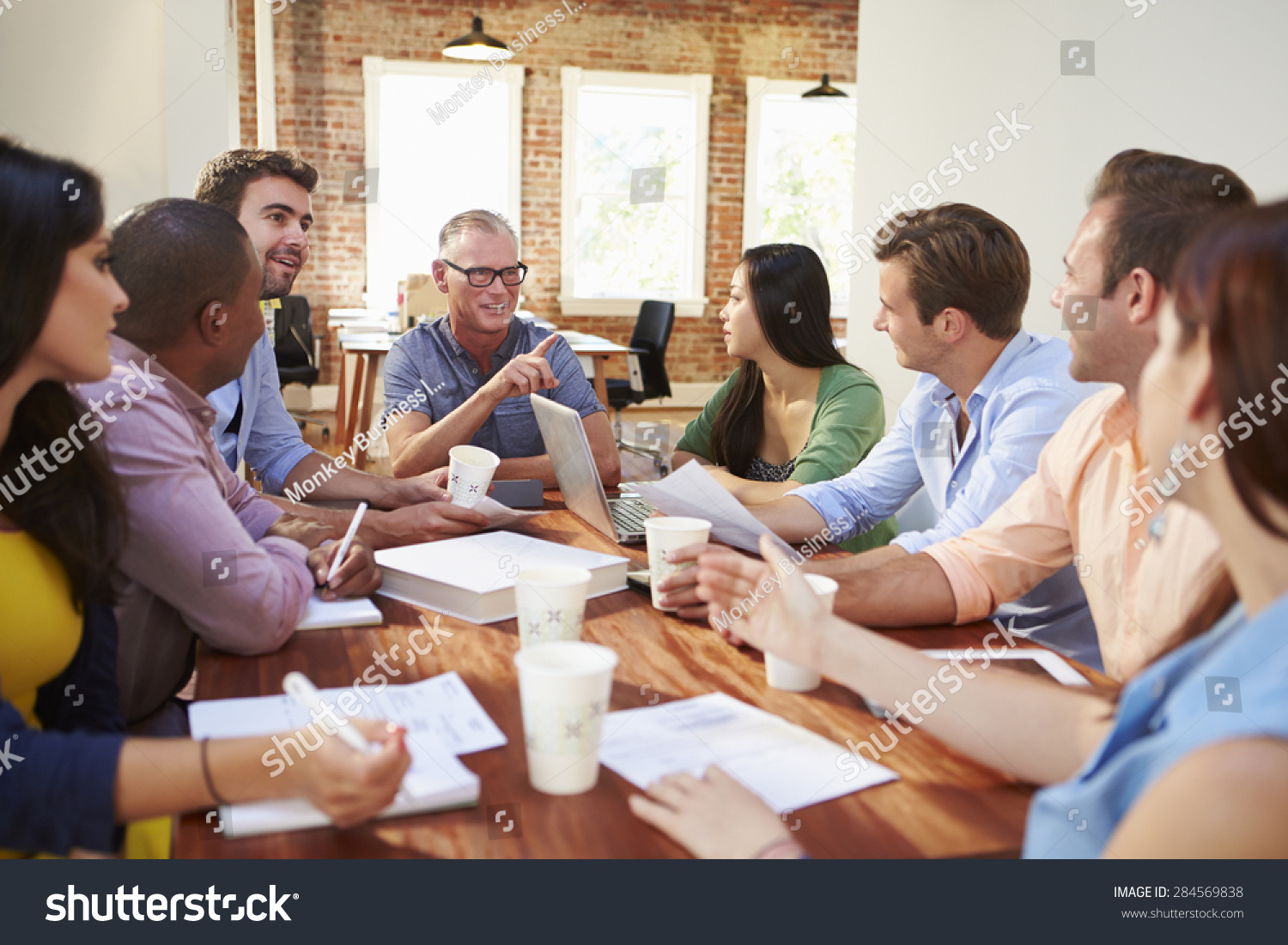 Group Of Office Workers Meeting To Discuss Ideas #284569838