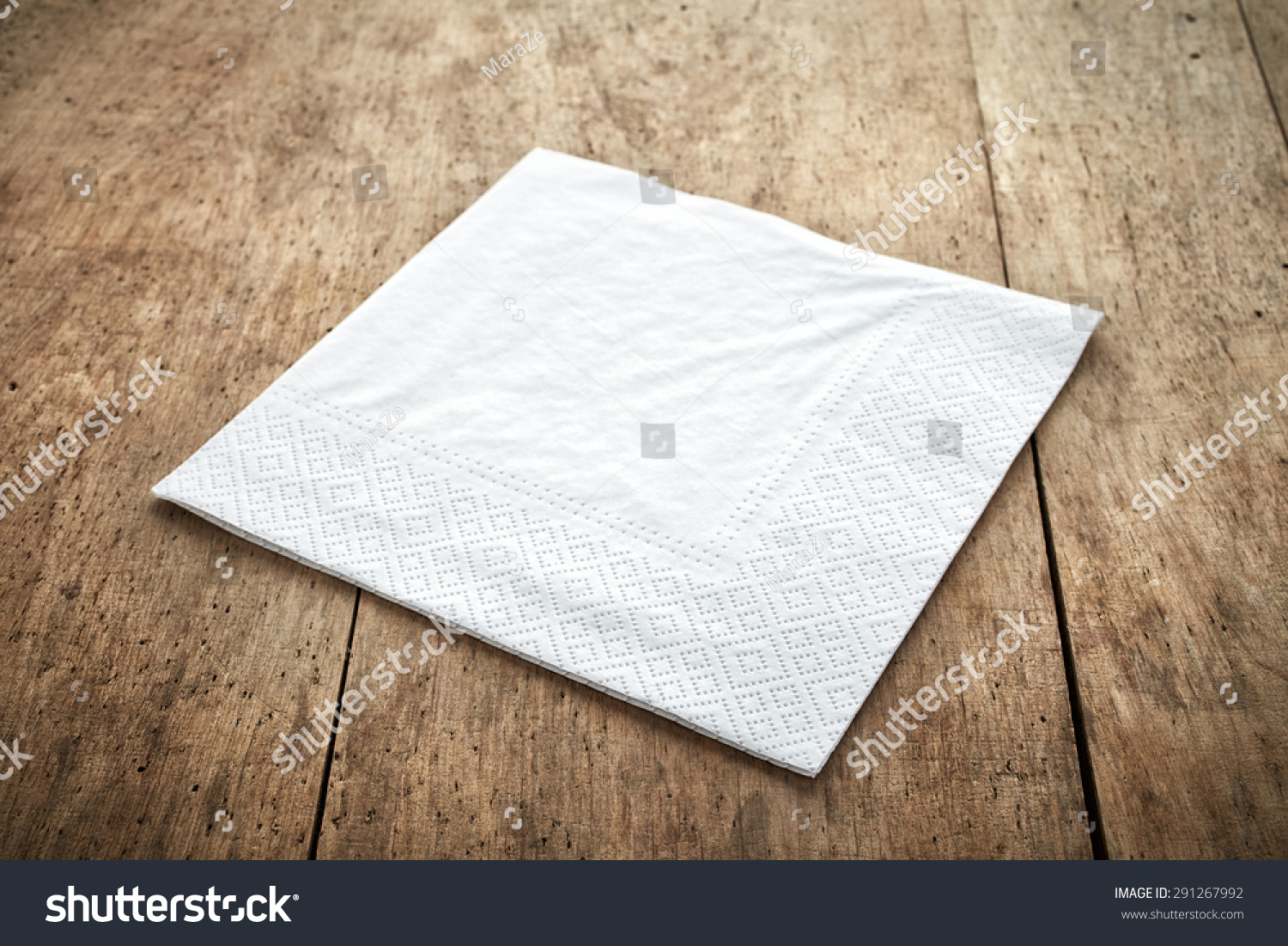 white paper napkin on old wooden table #291267992