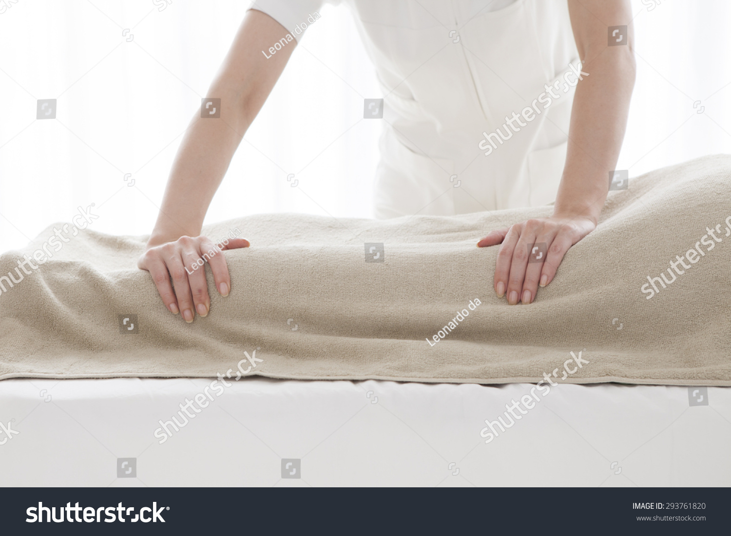 Hands of masseur massaging female back #293761820