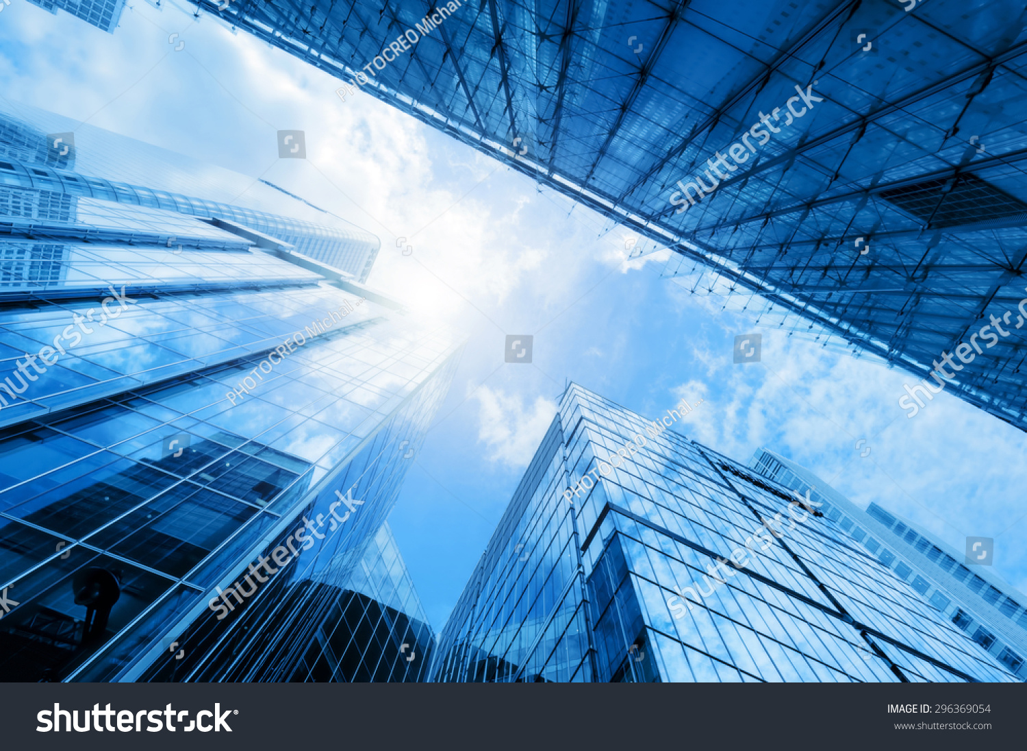 Common modern business skyscrapers, high-rise buildings, architecture raising to the sky, sun. Concepts of financial, economics, future etc. #296369054