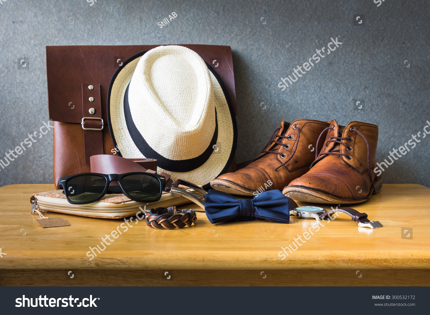 Men's casual outfits on wooden table over wall grunge background #300532172