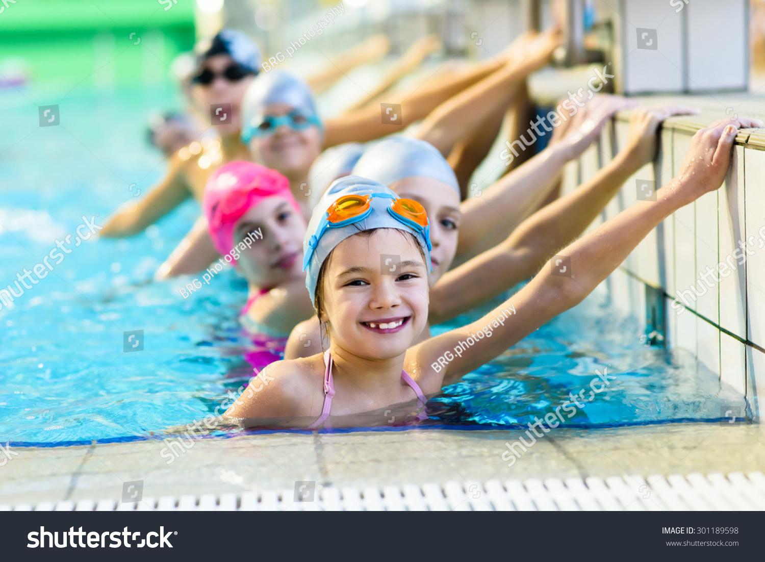 young and successful swimmers pose #301189598