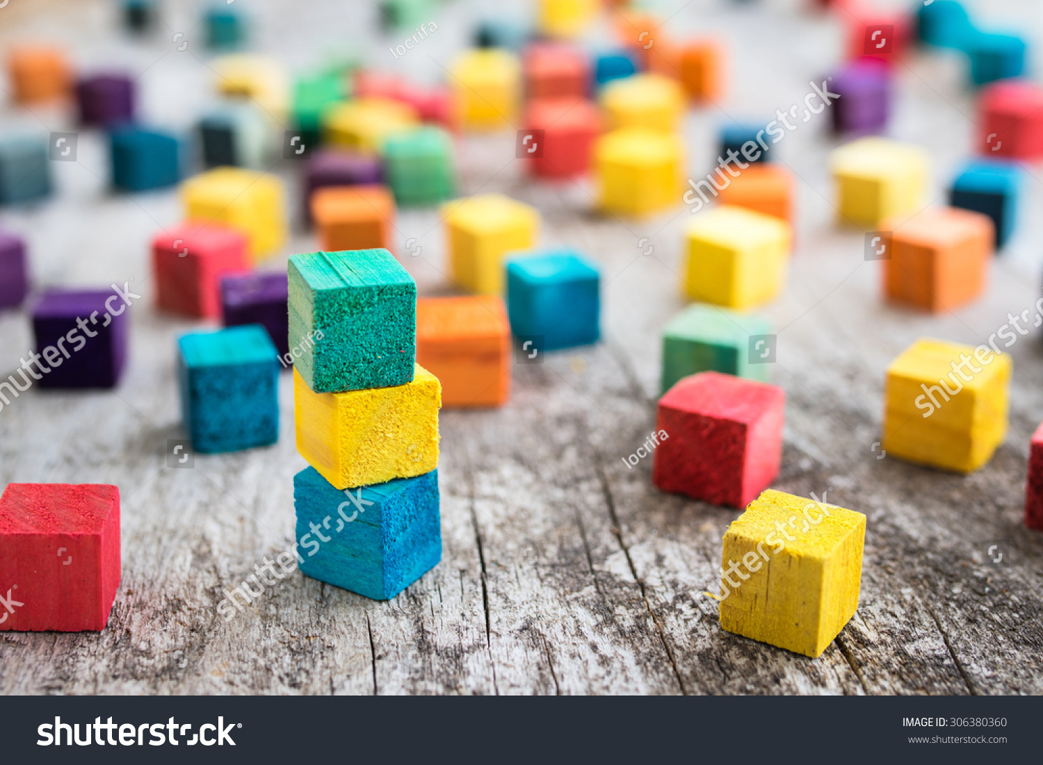 Colorful wooden building blocks. Selective focus #306380360