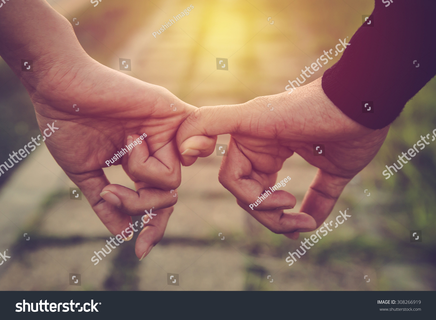 Valentine day background. Happy couple holding hands together as forever love. Vintage filter. #308266919