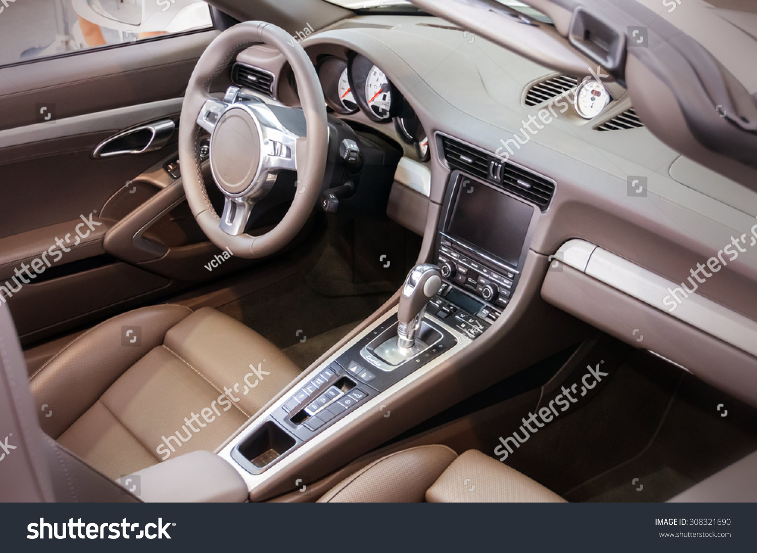 Dark luxury car Interior - steering wheel, shift lever and dashboard #308321690