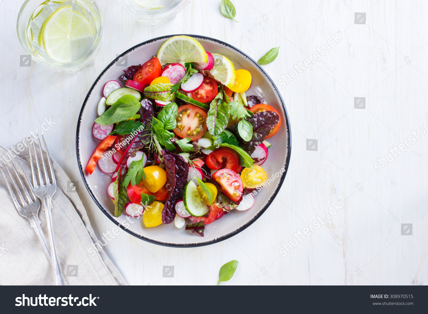Salad with fresh summer vegetables, top view #308970515