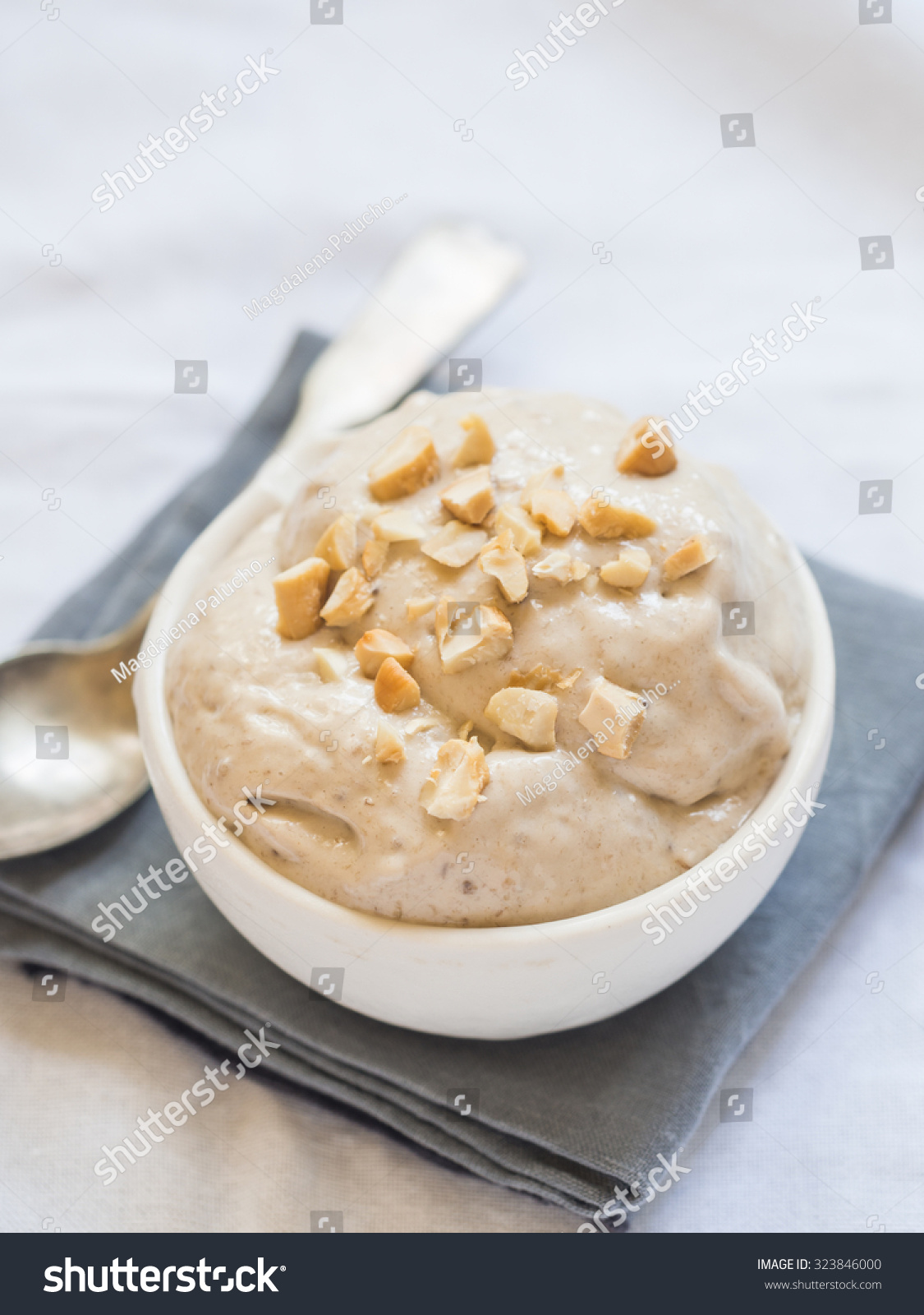 Homemade vegan banana ice cream (here, halva flavored, with tahina) served with cashew nuts. #323846000