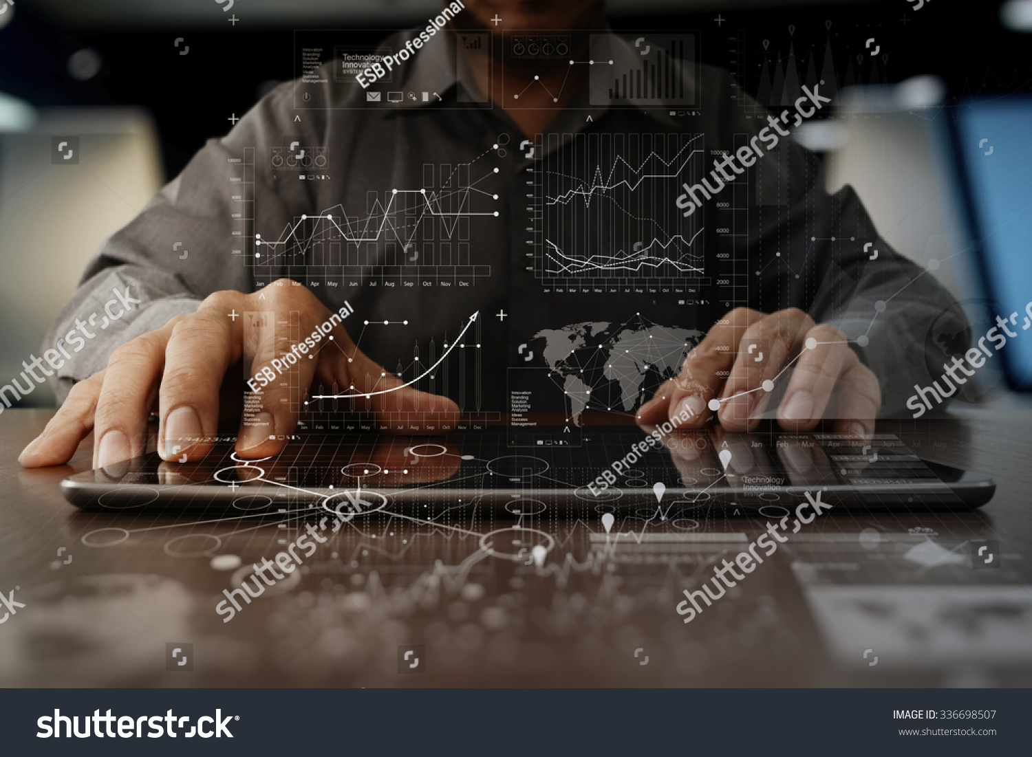 businessman hand working on laptop computer with digital layer business strategy and social media diagram on wooden desk #336698507