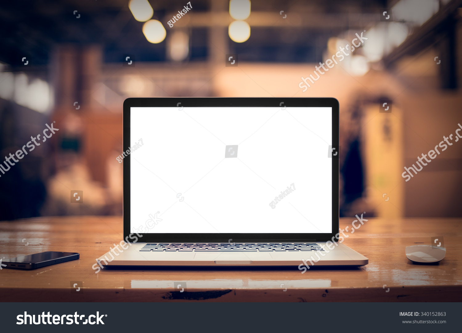 Laptop with blank screen on table. #340152863