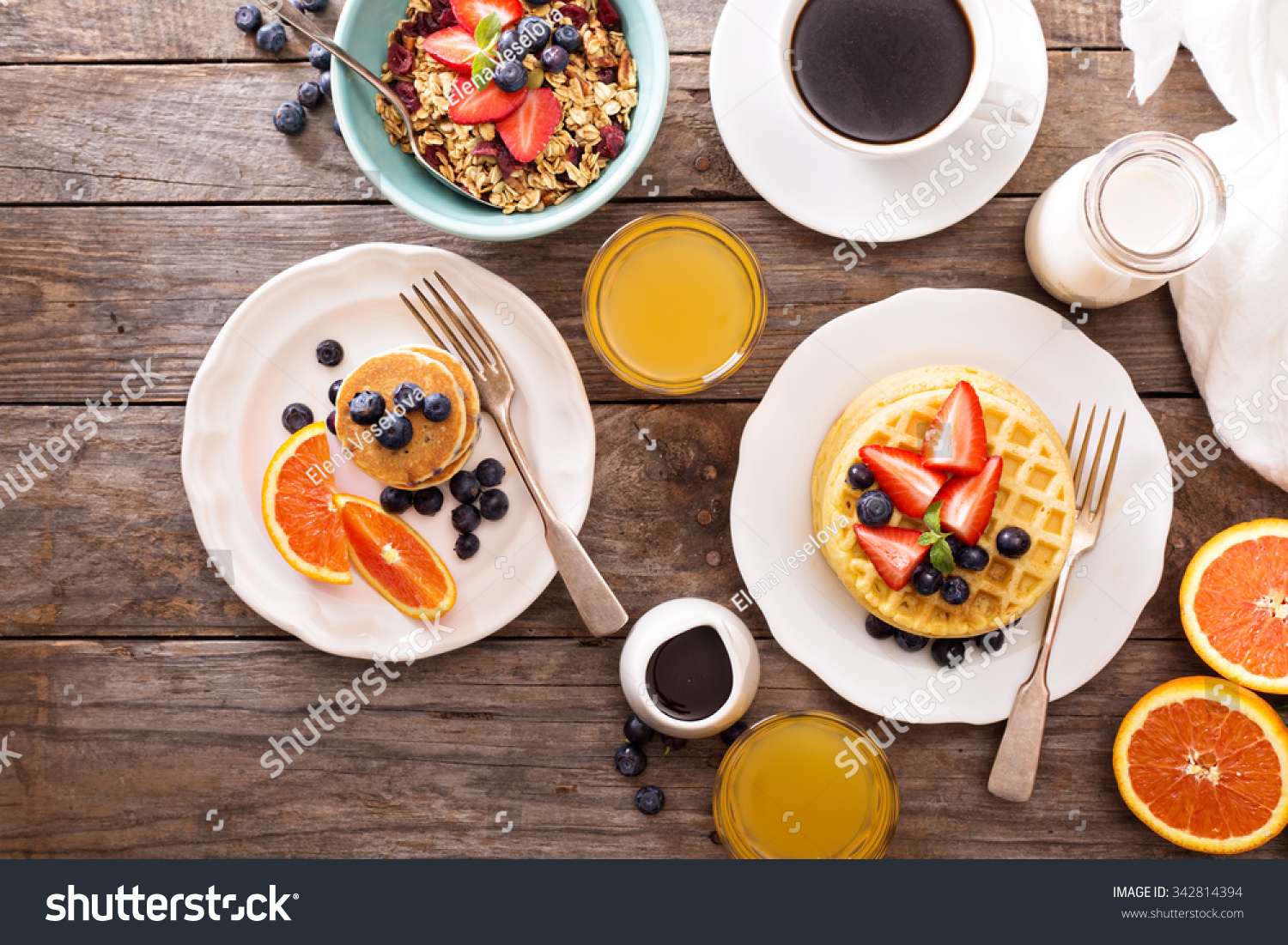 Breakfast table with waffles, granola and fresh berries #342814394