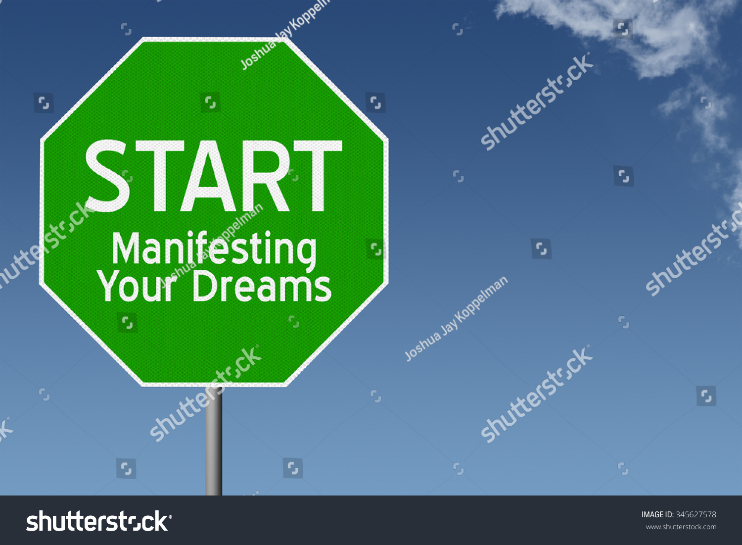 Start Manifesting Your Dreams text on green stop sign with blue sky background and copy space #345627578
