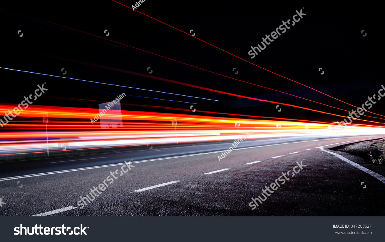 Three red lines / red light trails at night on the road #347208527