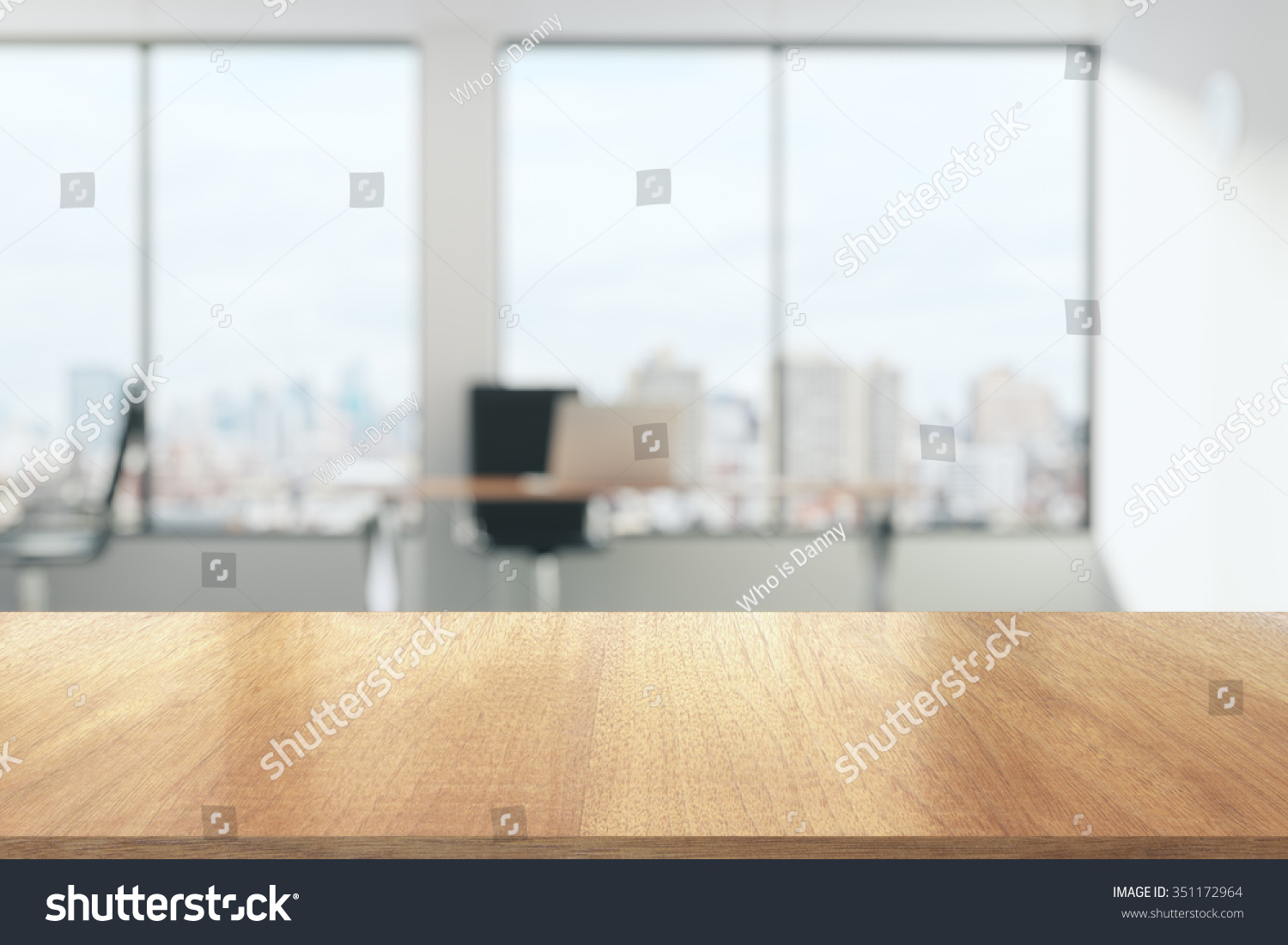 Wooden table in sunny office with big windows #351172964