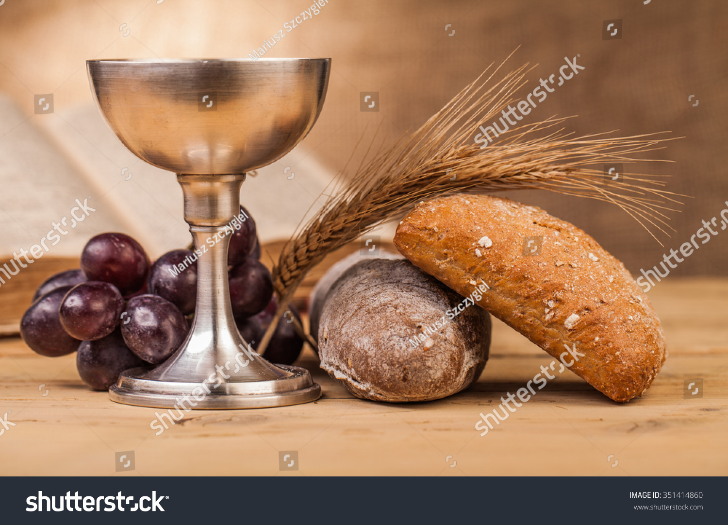holy communion chalice on wooden table #351414860