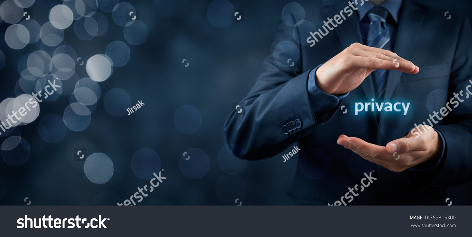 Privacy policy concept. Businessman with protective gesture and text privacy in hands. Wide banner composition with bokeh in background. #369815300