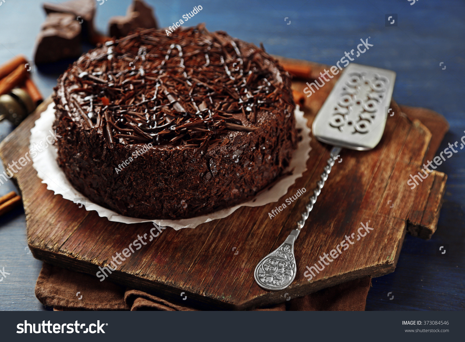 Tasty chocolate cake on color wooden background #373084546