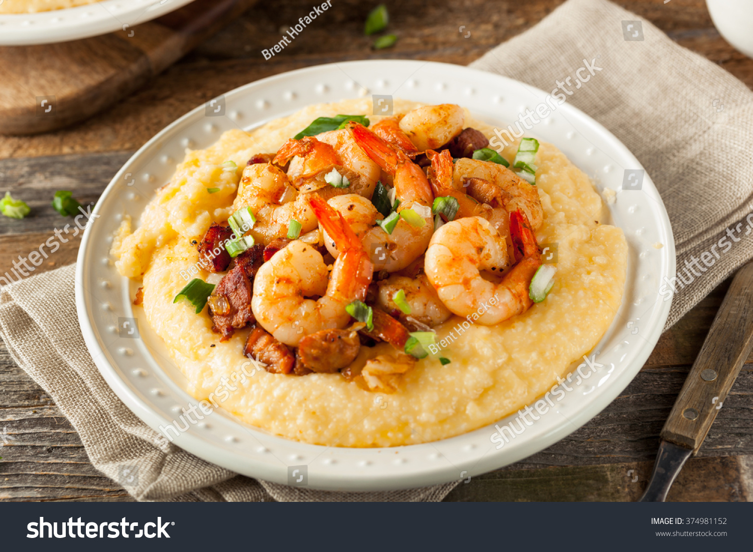 Homemade Shrimp and Grits with Pork and Cheddar #374981152