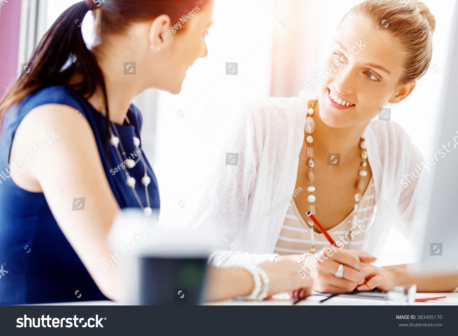 Two female colleagues in office #383405170