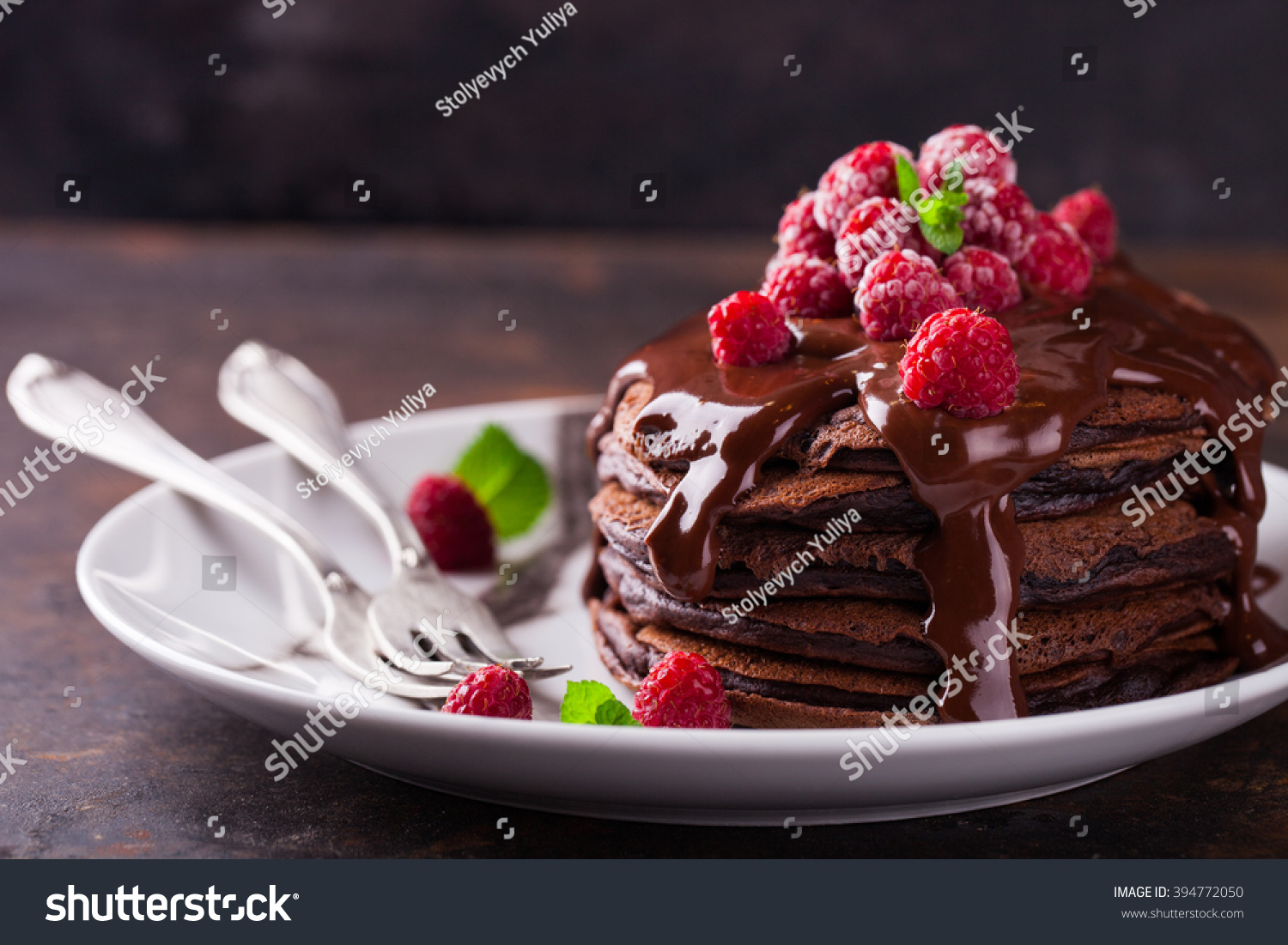 Chocolate pancake with chocolate glaze,raspberries and mint.selective focus #394772050