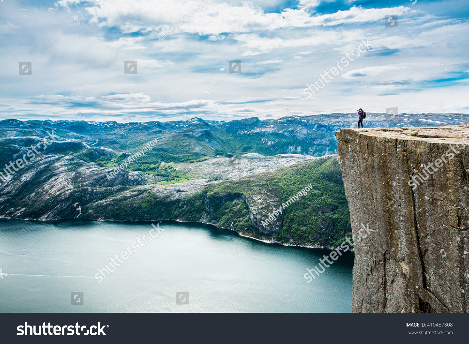 Preikestolen or Prekestolen, also known by the English translations of Preacher's Pulpit or Pulpit Rock, is a famous tourist attraction in Forsand, Ryfylke, Norway #410457808