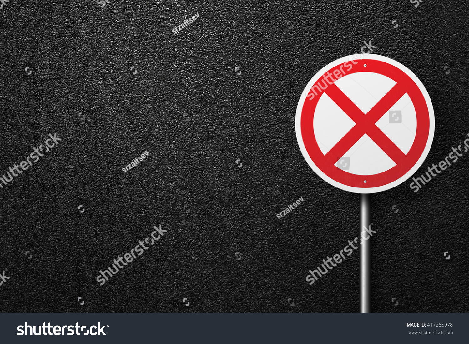 Road sign of the circular shape on a background of asphalt. The texture of the tarmac, top view. #417265978