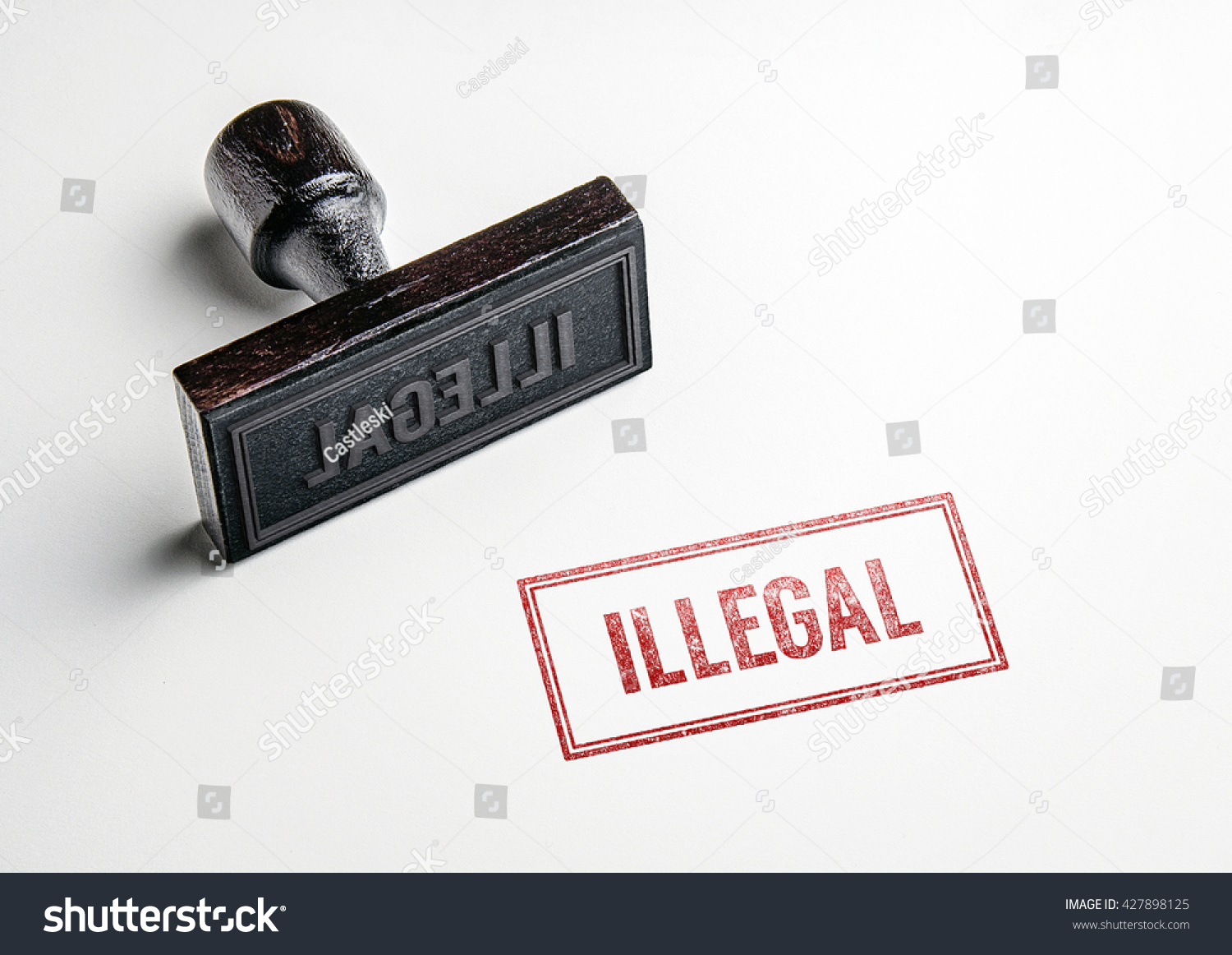 Rubber stamping that says 'Illegal'. #427898125