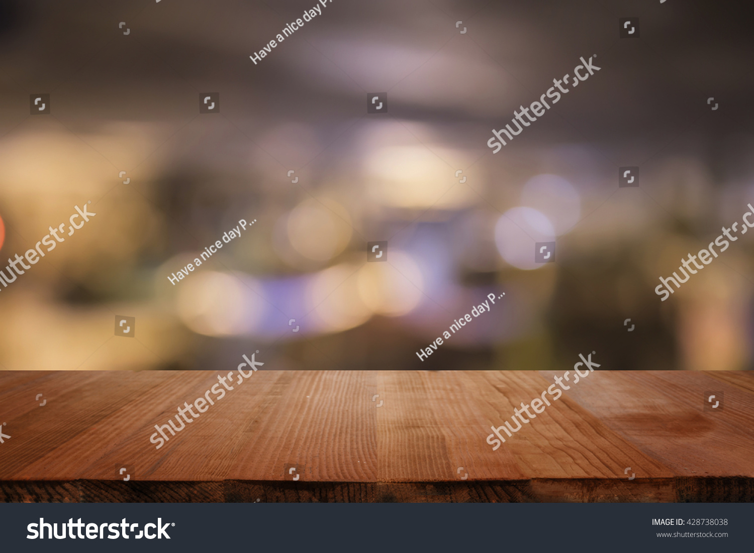  Empty brown wooden table and blur background of abstract  of resturant lights people enjoy eating ,can be used for montage or display your products
  #428738038