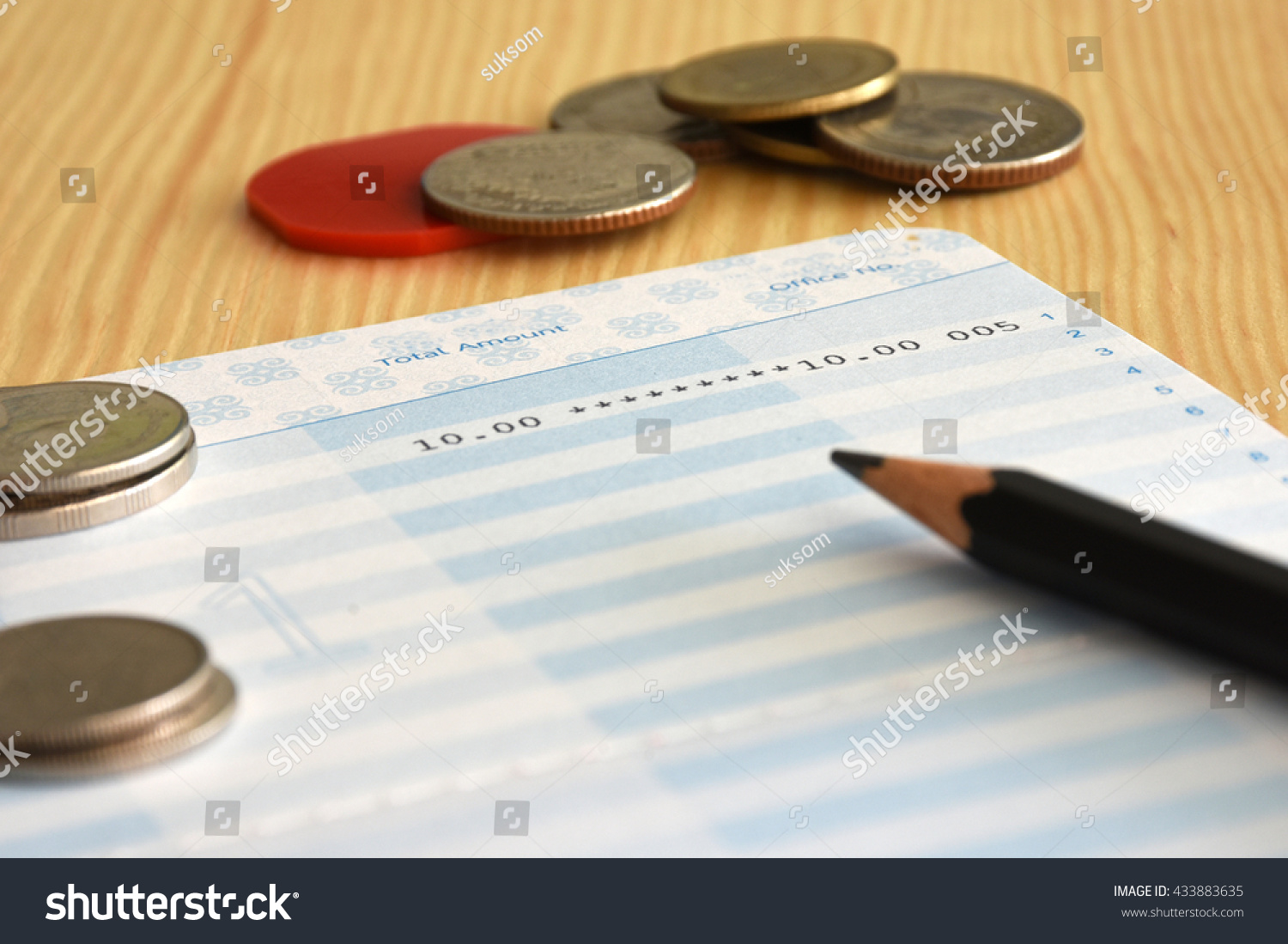 Saving account from bank with coins and pencil on the table for financial and loan #433883635