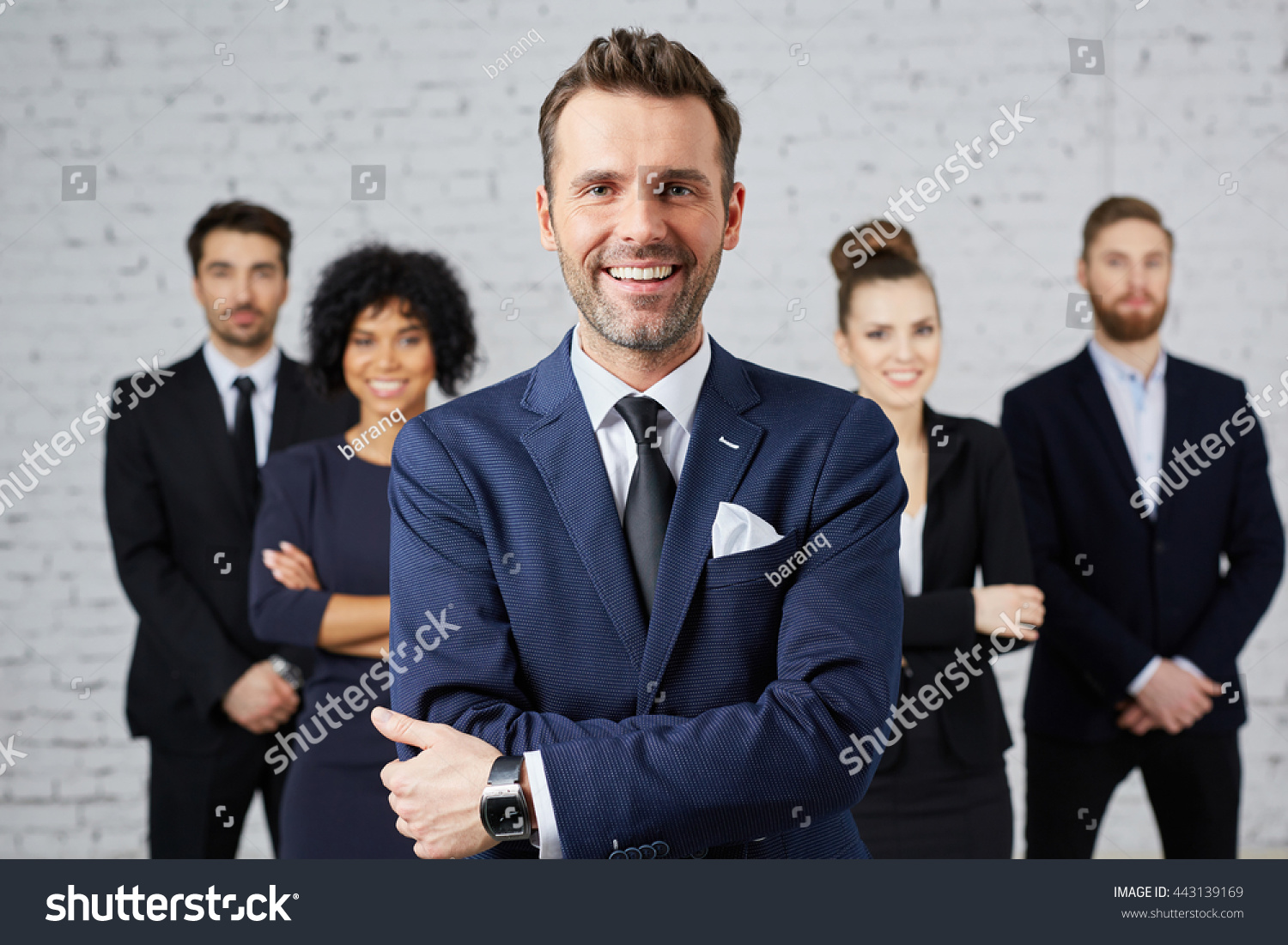 Group of business people with leader at front #443139169