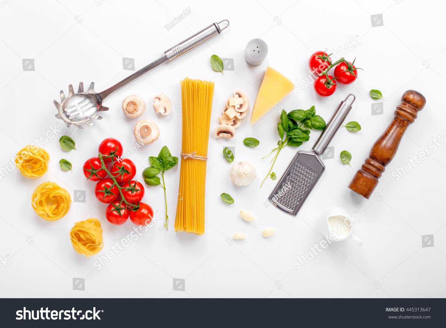 Fettuccine and spaghetti with ingredients for cooking pasta on a white background, top view. Flat lay #445313647