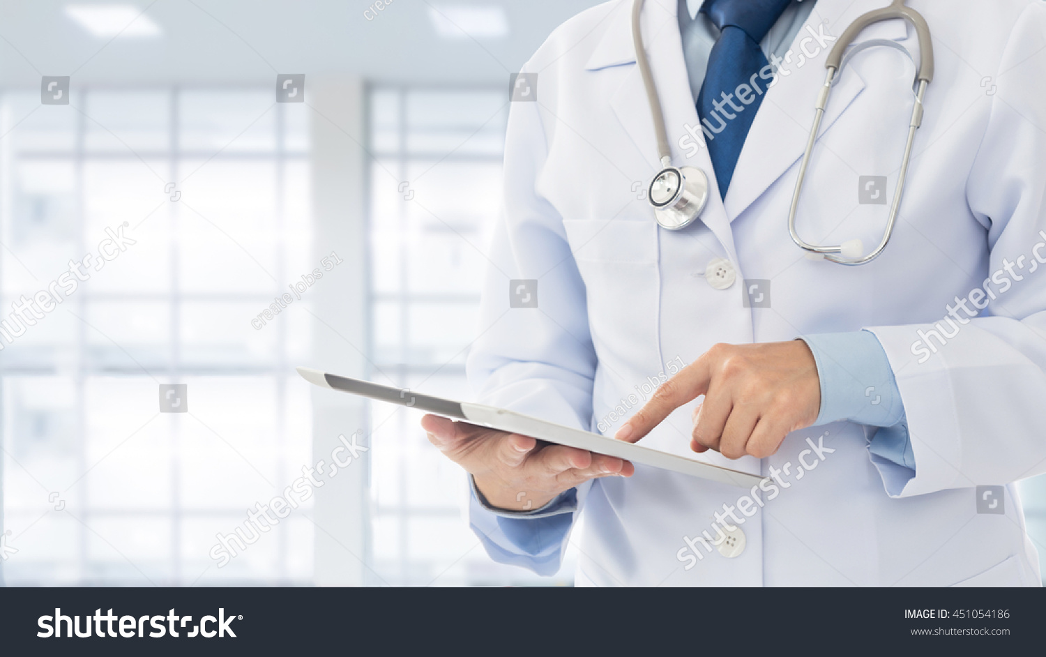 Doctor using digital tablet find information patient medical history at the hospital. Medical technology concept.

 #451054186