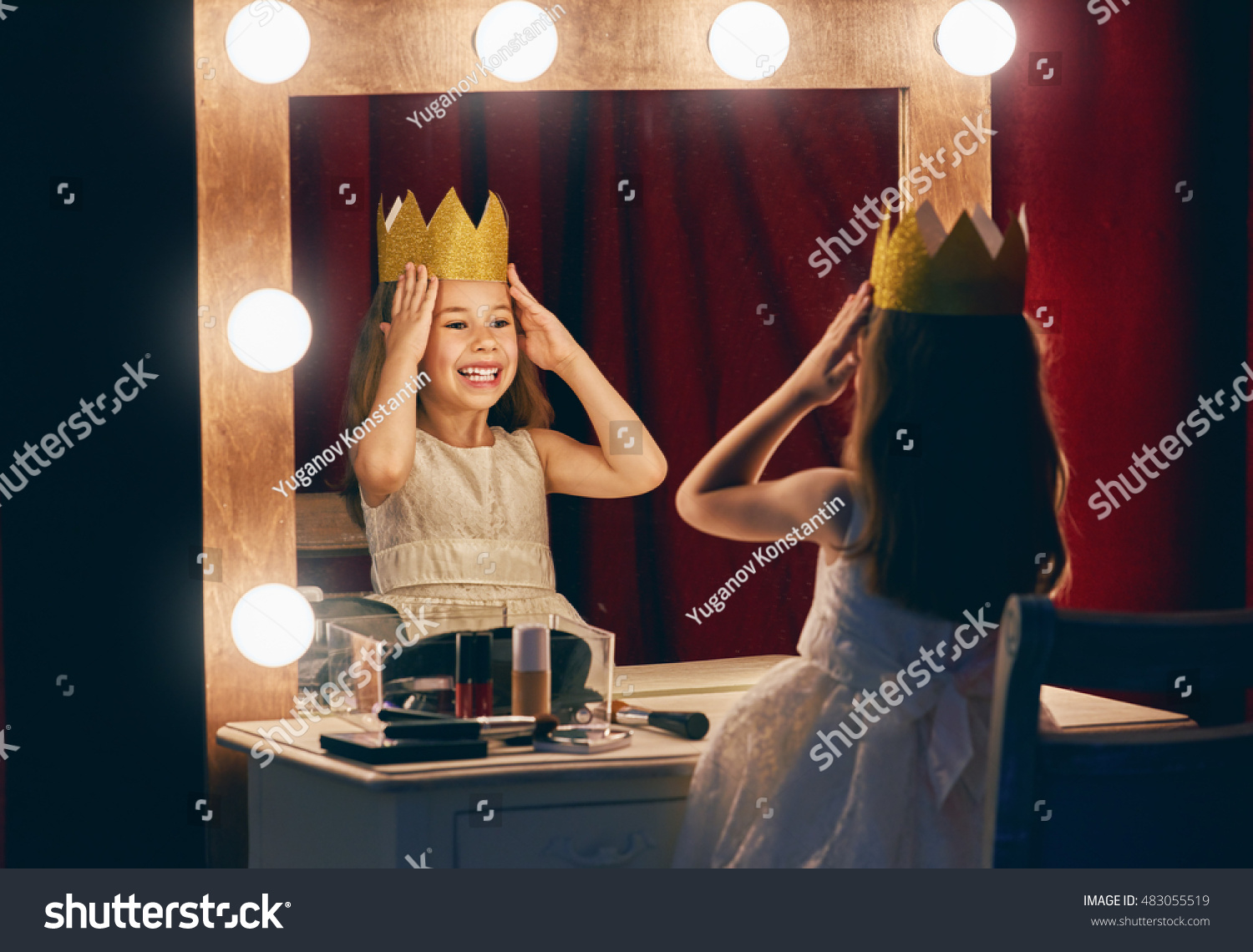 Cute little actress. Child girl in Princess costume on the background of theatrical scenes and mirrors. #483055519